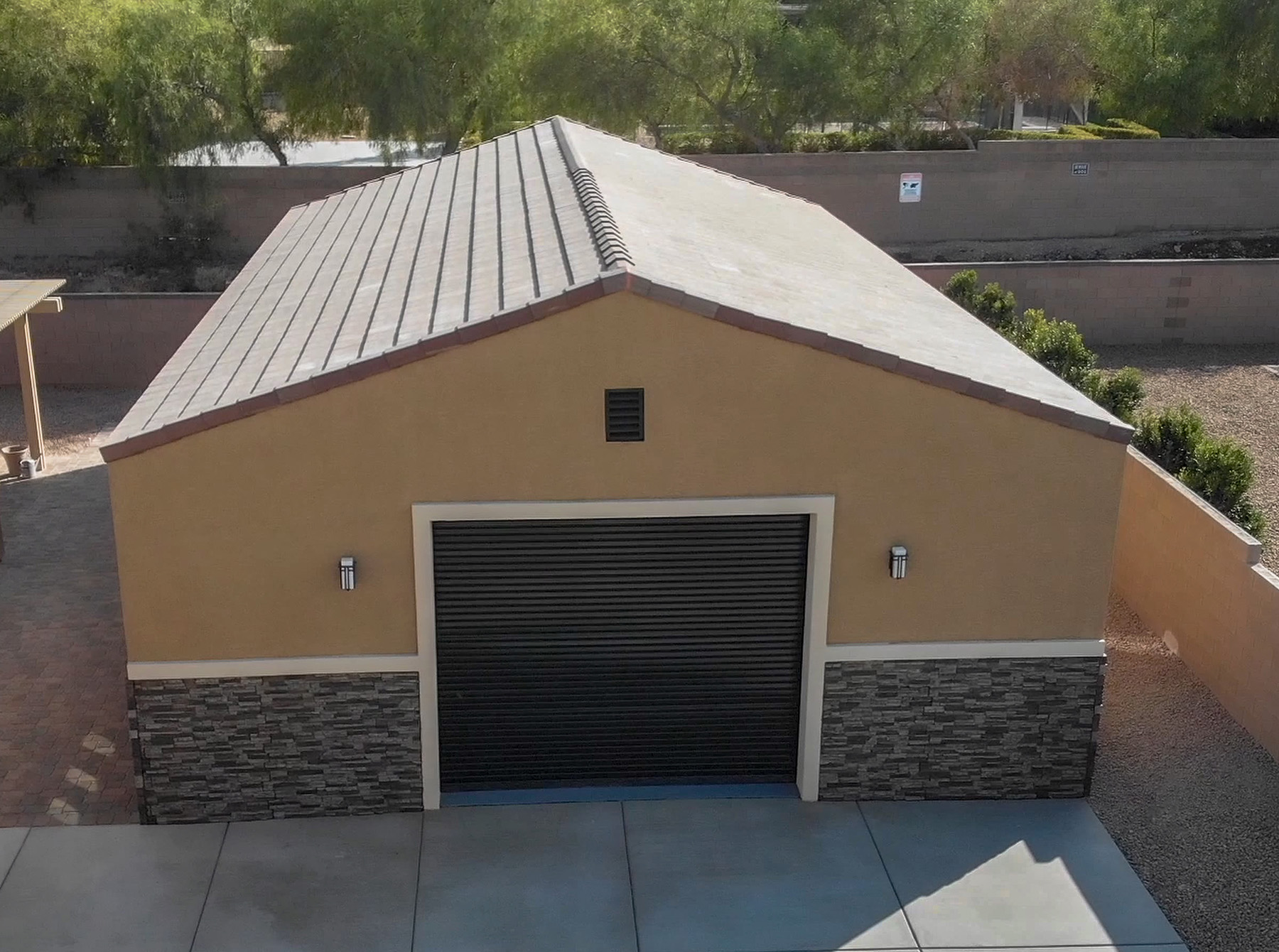 Great Western Buildings metal building kit in Las Vegas, Nevada with Stucco and brick siding and a traditional tile roof to meet HOA standards