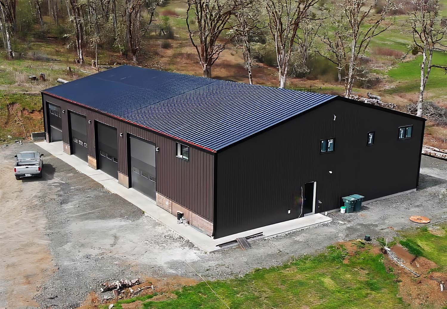 Oregon Contractor steel metal building on property among trees and grass