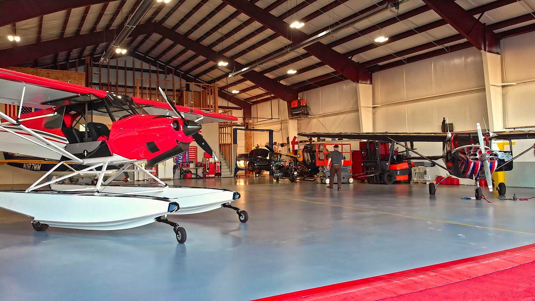 Front higher power door open on custom multi-aircraft hangar by Great Western Buildings in Hayden, Idaho