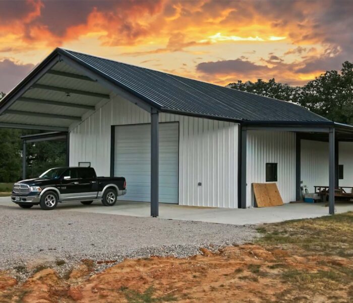 Barndominium residential steel building in Texas shot during the sunset